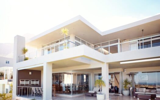 Modern real estate buildings in Greece with rising property prices forecast for 2025 and beyond in urban and island markets.