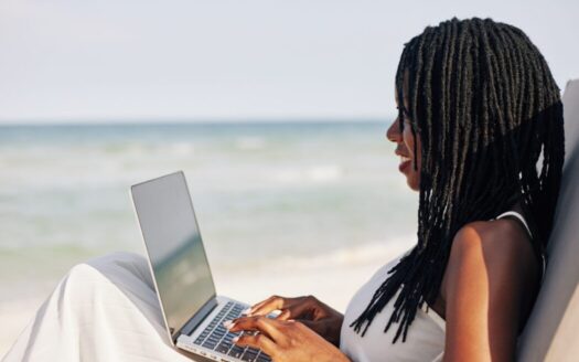 Remote worker enjoying sea view from home office in Greece, showcasing reasons behind buying property in Greece for digital nomads. 2/2