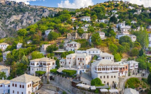 Traditional stone rural property in Greek countryside, representing pros and cons of investing in rural Greek real estate.