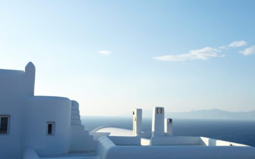 Property for sale in Greece, showcasing a beautifully staged villa with curb appeal and a scenic view, representing tips on how to sell property faster and for more.