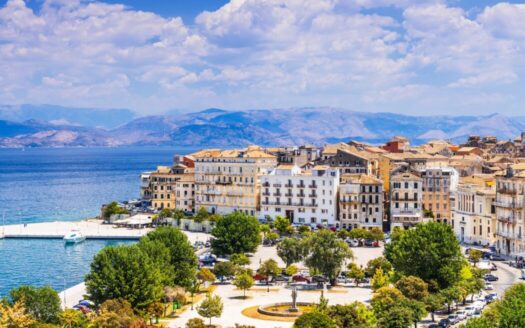 A scenic coastal view of Corfu island with luxury villas and lush greenery showing Greece’s property market trends in 2025.
