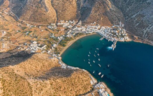 Couple remotely viewing Greek property via virtual tour, illustrating buying property sight unseen in Greece safely and effectively