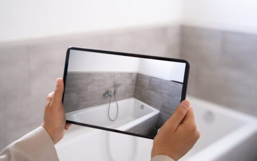 Couple remotely viewing Greek property via virtual tour, illustrating buying property sight unseen in Greece safely and effectively