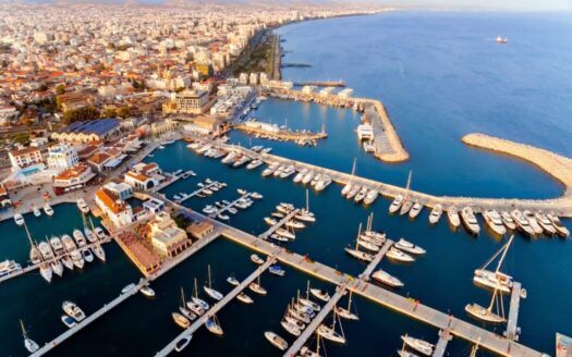Aerial view of Greek island villas near the sea, perfect for rental income investment