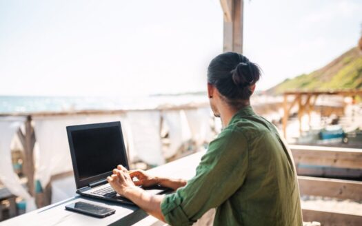 Digital nomads buying real estate in Greece, enjoying the beautiful landscape of Corfu with a property investment in mind.