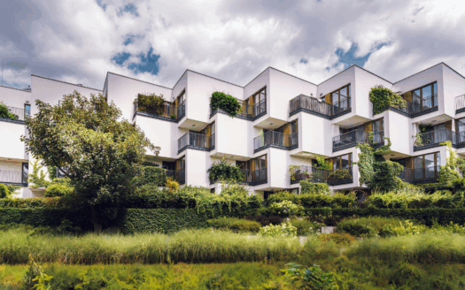Eco-friendly home with solar panels, sustainable materials, and green landscaping in Greece.