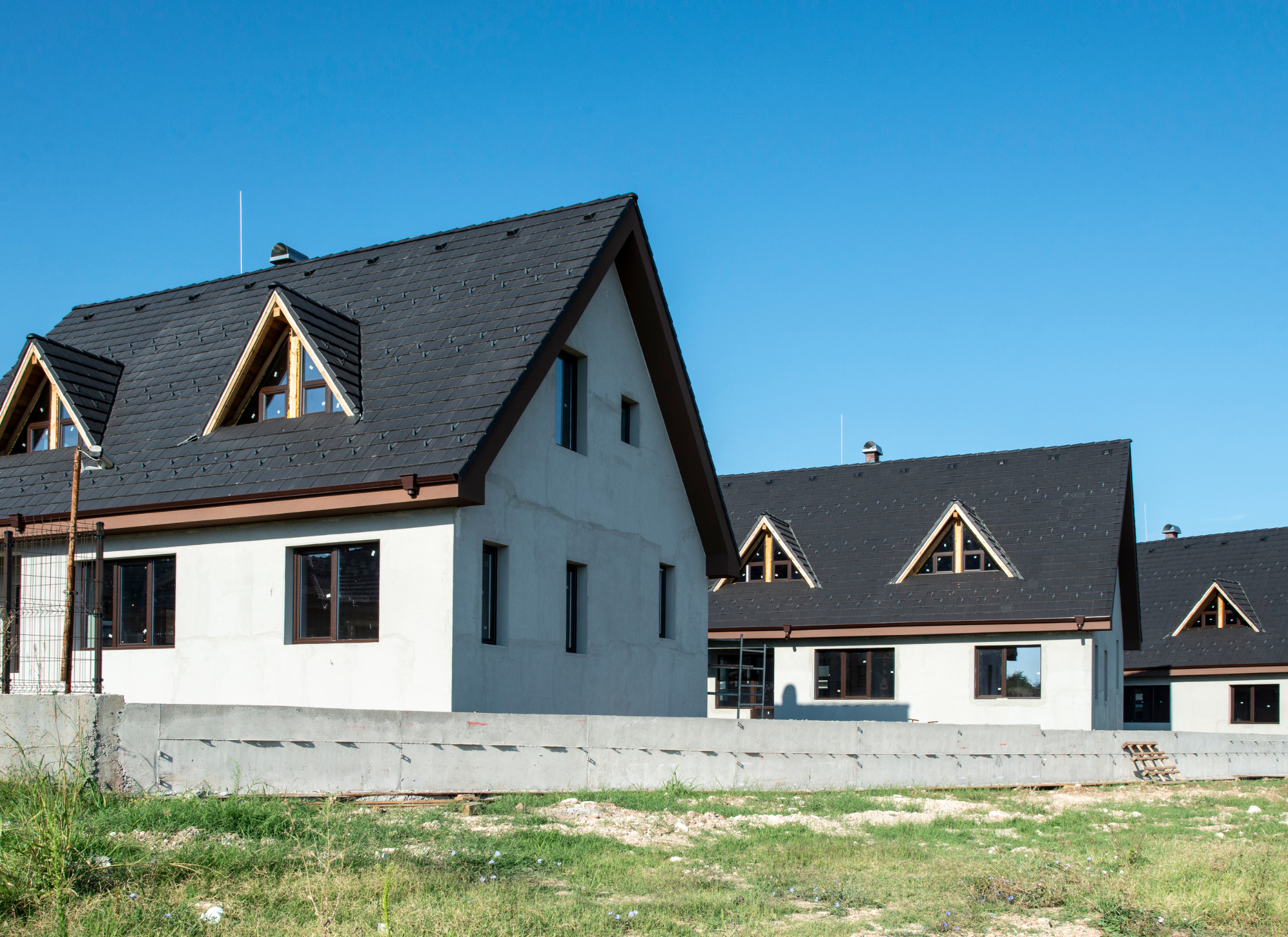Newly built home vs older property in Corfu with energy-efficient features and traditional Greek architecture.