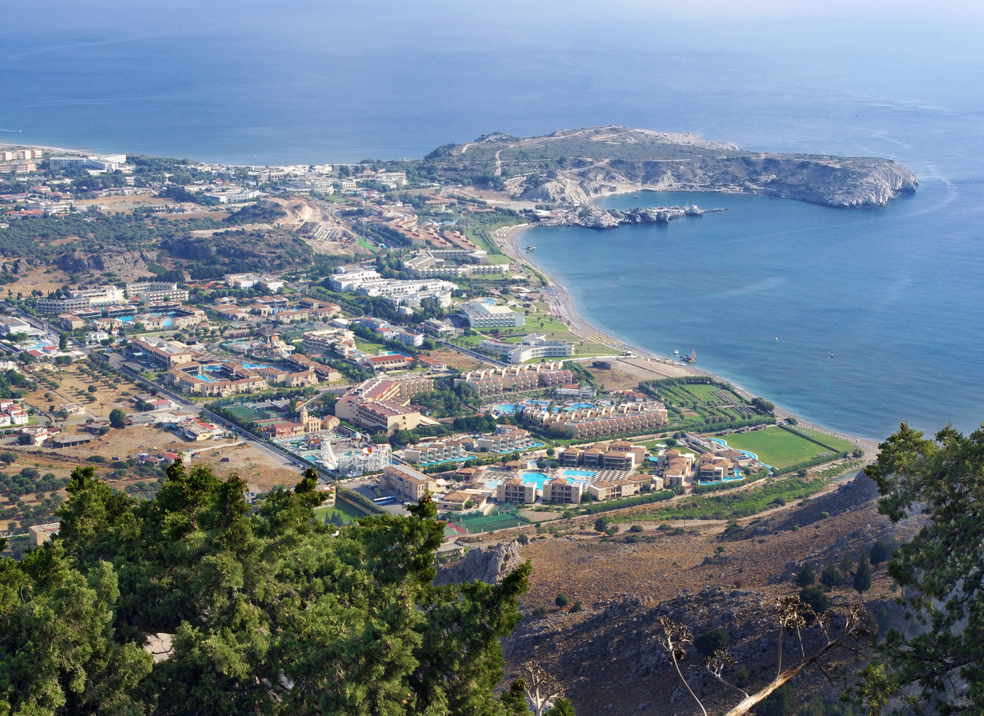 A panoramic view of Corfu showcasing attractive residential and commercial properties ideal for long-term investment.