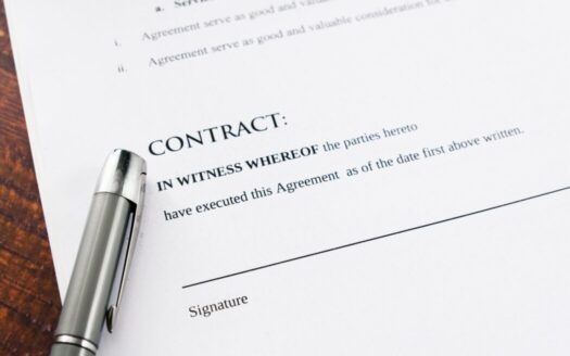 Greek property contract being signed with a notary, showcasing important legal documents and real estate paperwork for foreign buyers.