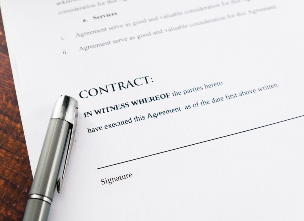 Greek property contract being signed with a notary, showcasing important legal documents and real estate paperwork for foreign buyers.