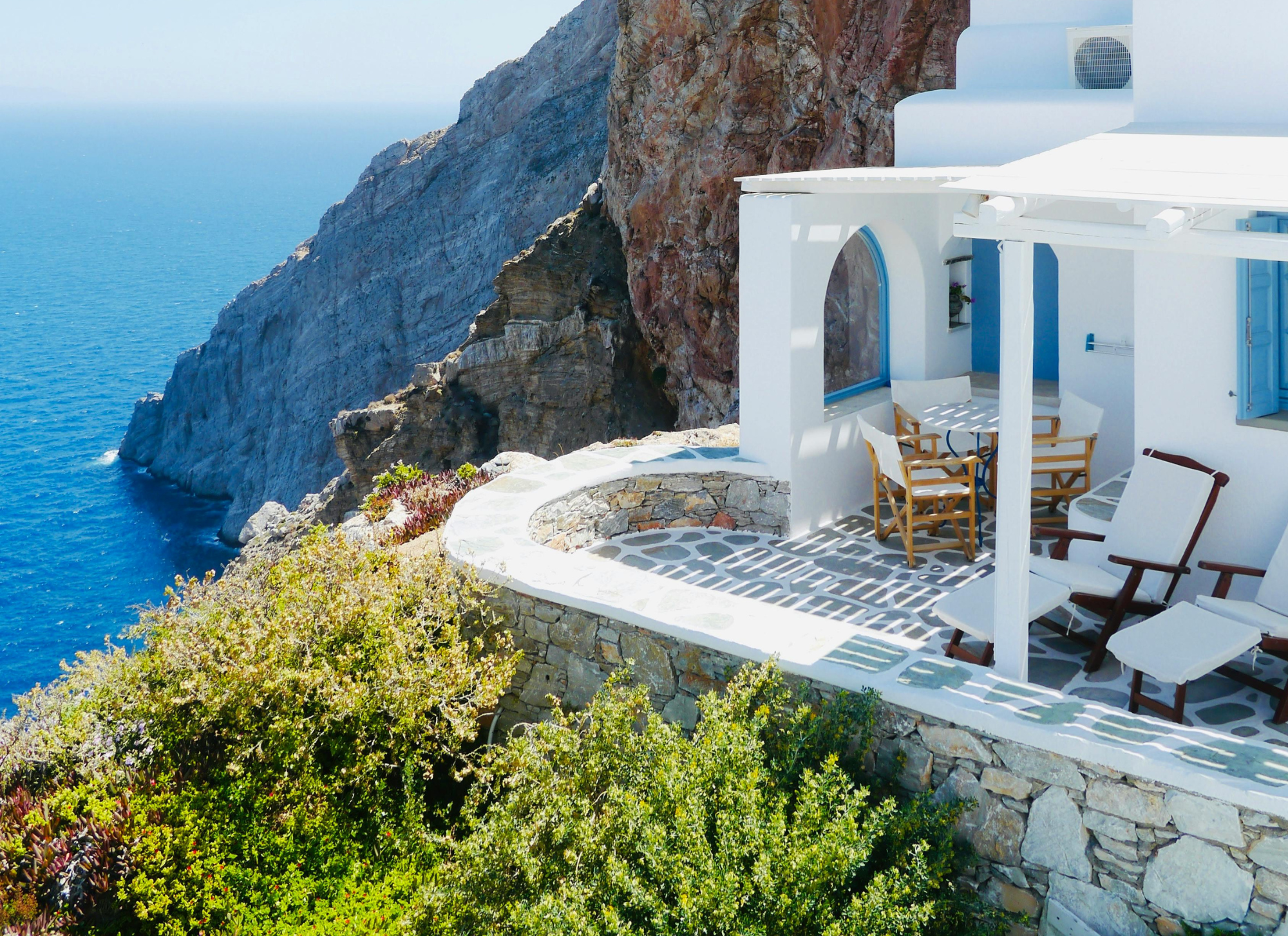 Beautiful seaside villa in Greece with panoramic views, showcasing a well-maintained property for sale during peak tourist season, perfect for buyers in 2025.
