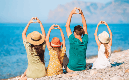 A family enjoying a beachside villa in Corfu, highlighting the ideal location for a family vacation home.