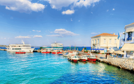 Serene Greek coastal village ideal for retirees buying a home and securing residency in Greece in 2025.