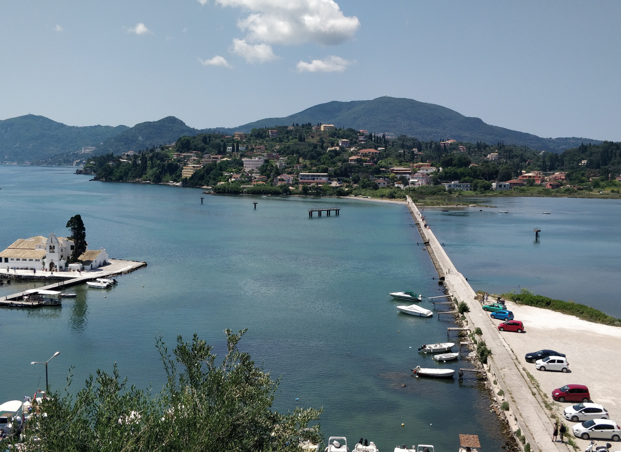 A picturesque view of Perama, Corfu, showing the beautiful coastal landscape and traditional Greek village charm.

