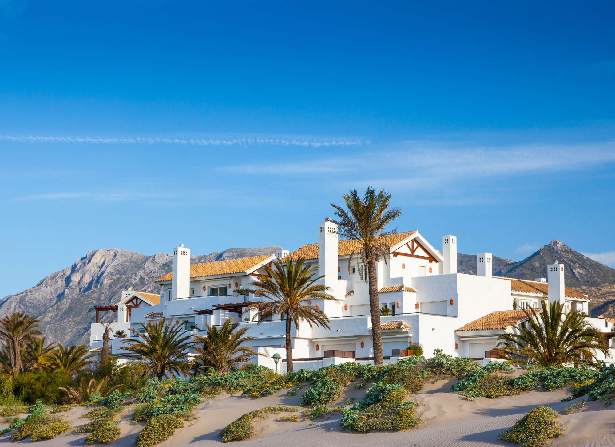 Selection of villas, apartments, and land for sale in Corfu, each offering unique views and investment opportunities.

