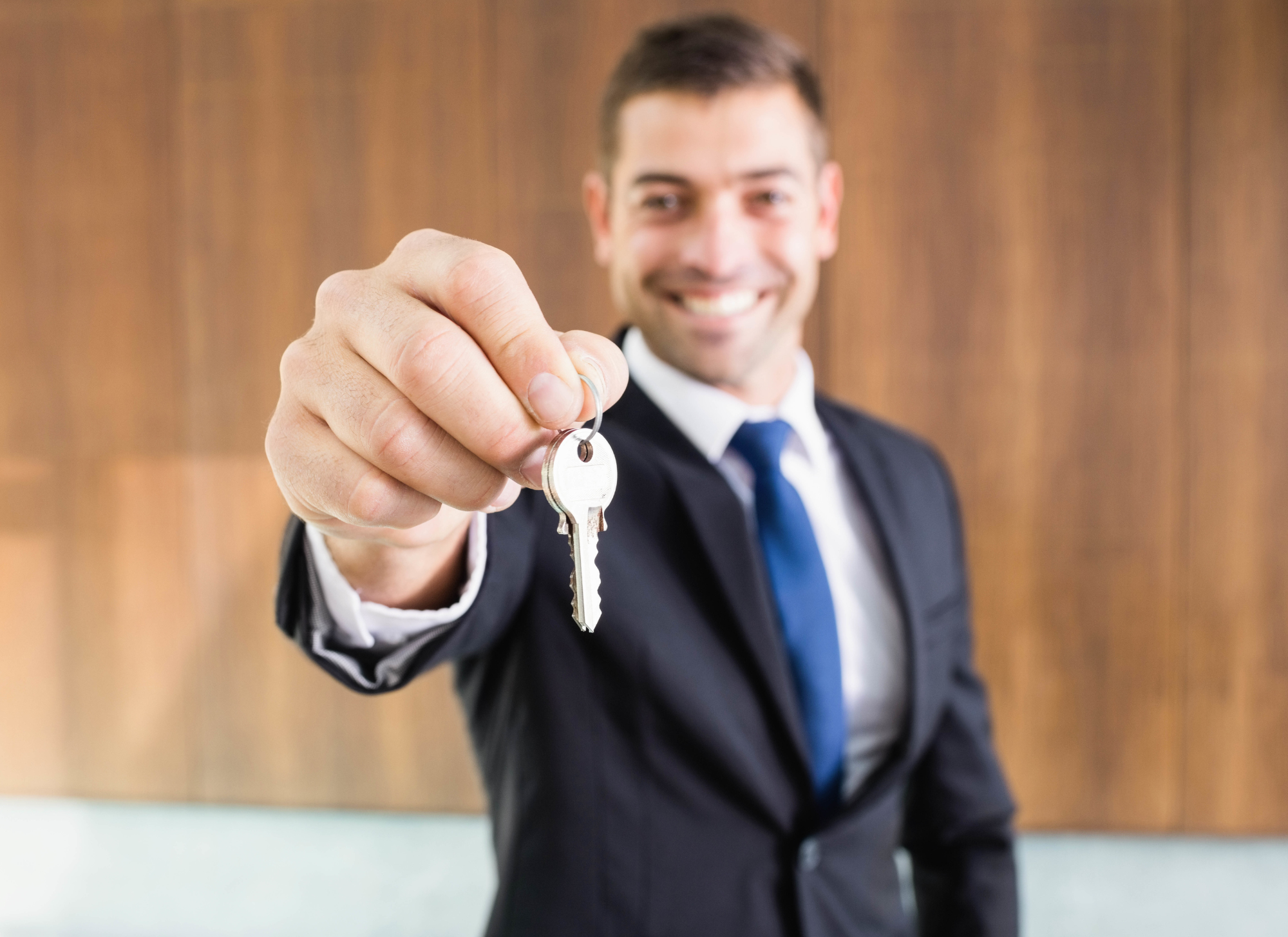 Real estate agent showing Corfu property to a buyer, highlighting key factors in choosing the right agent.