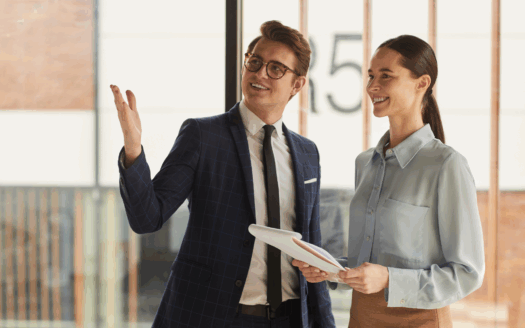 Corfu real estate agent discussing commission fees with clients in a modern office.