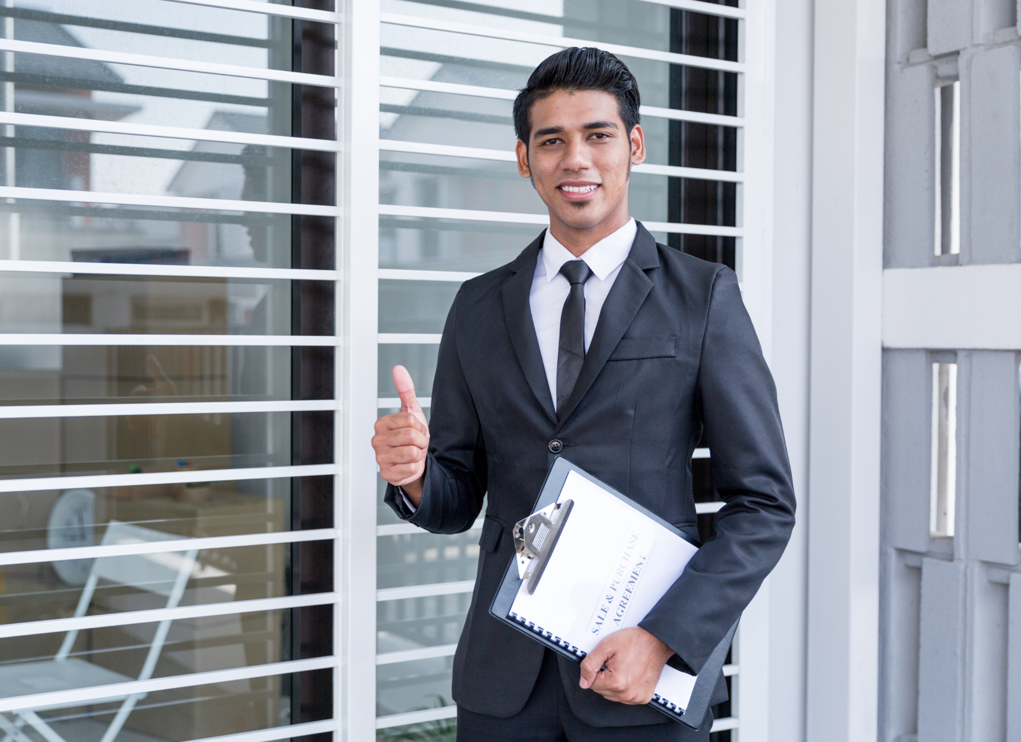 Beginner real estate investor analyzing properties and deciding on the best investment strategy.