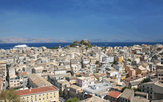 Aerial view of Corfu Town, showcasing a blend of historic and modern properties in the capital.