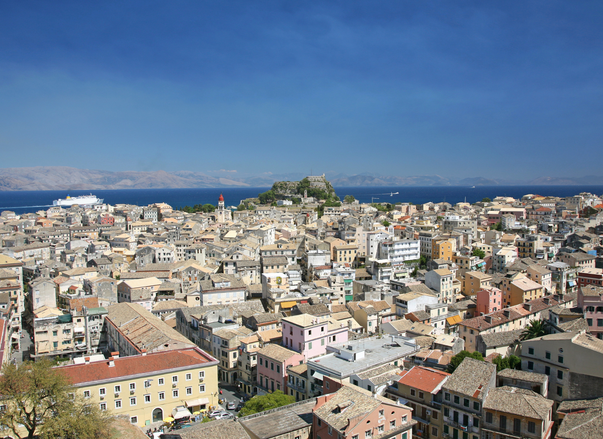 Aerial view of Corfu Town, showcasing a blend of historic and modern properties in the capital.
