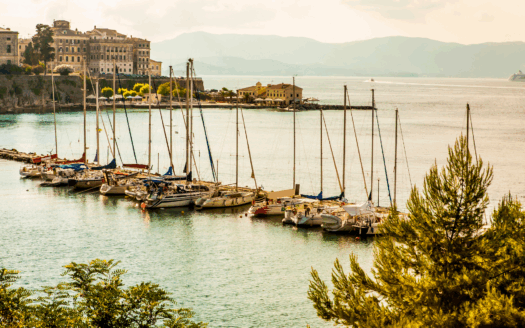 Corfu town skyline and marina, showing tourism hub that drives property demand