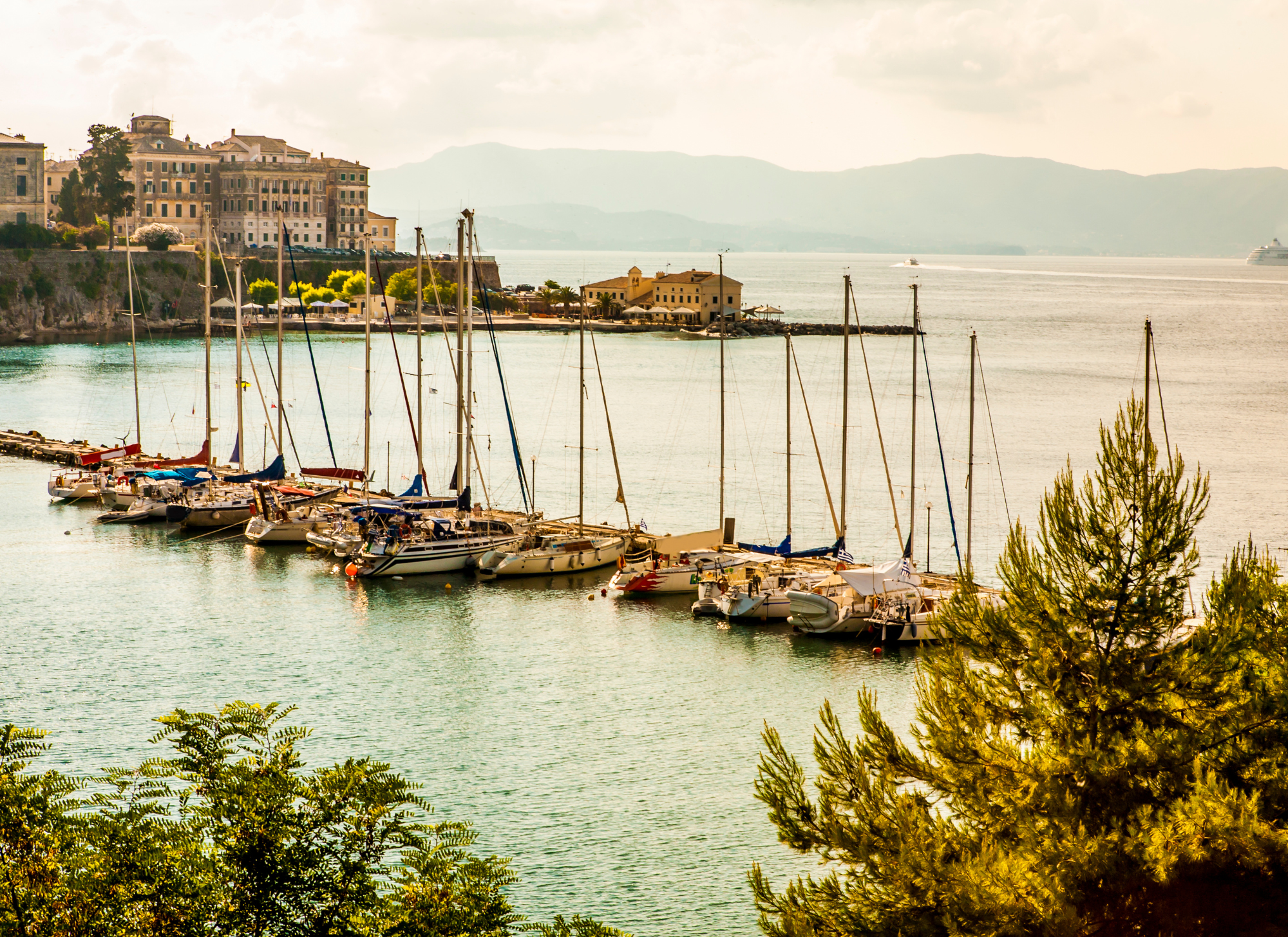 Corfu town skyline and marina, showing tourism hub that drives property demand