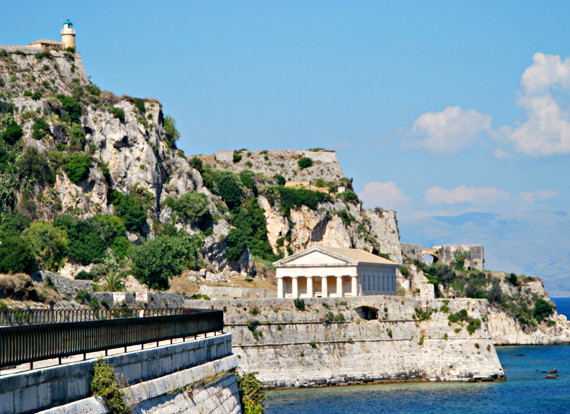Corfu compared with Santorini, Mykonos, and Crete showing property price differences for various regions.