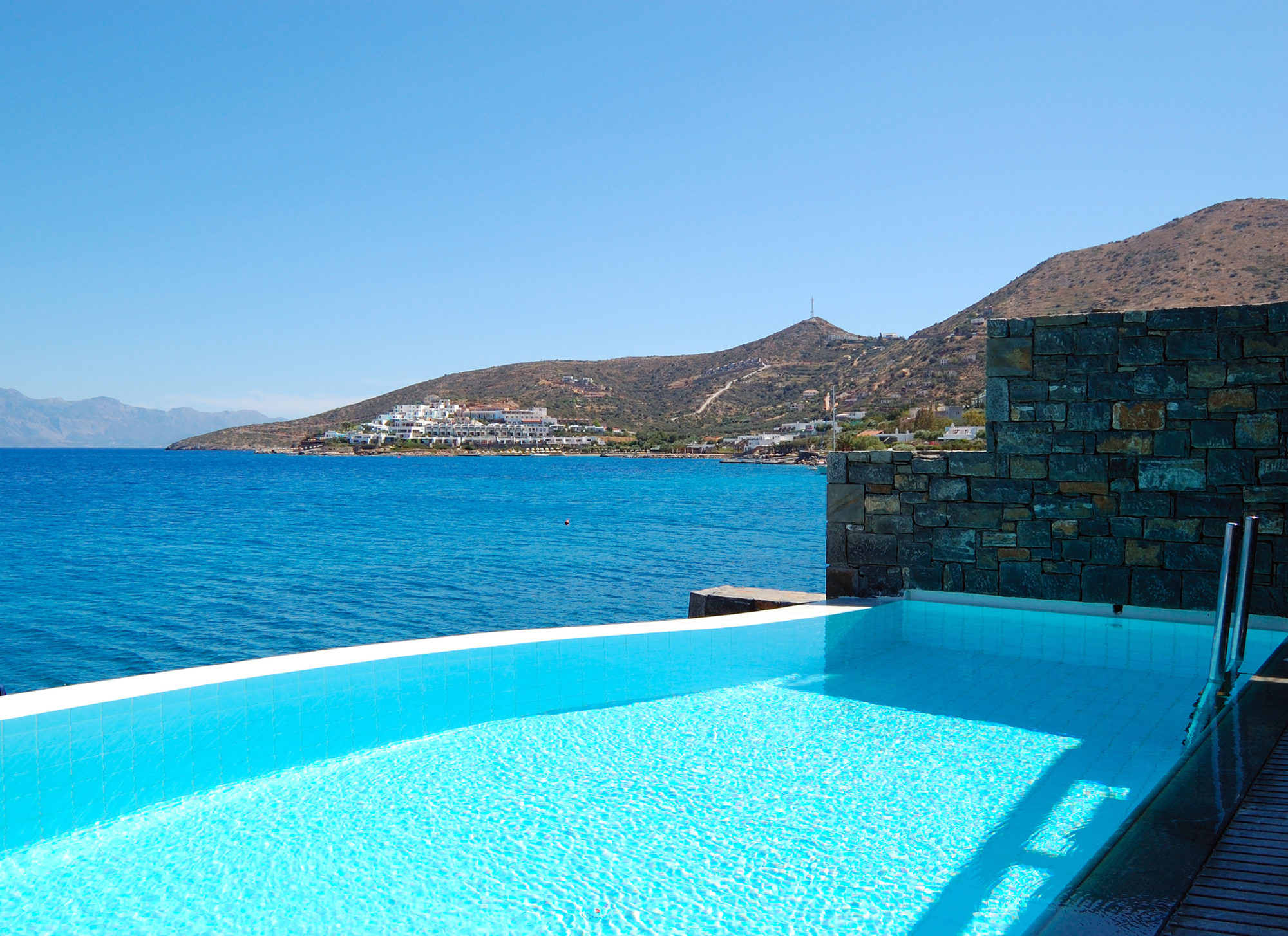 A luxury villa in Greece with panoramic sea views and modern architectural design.