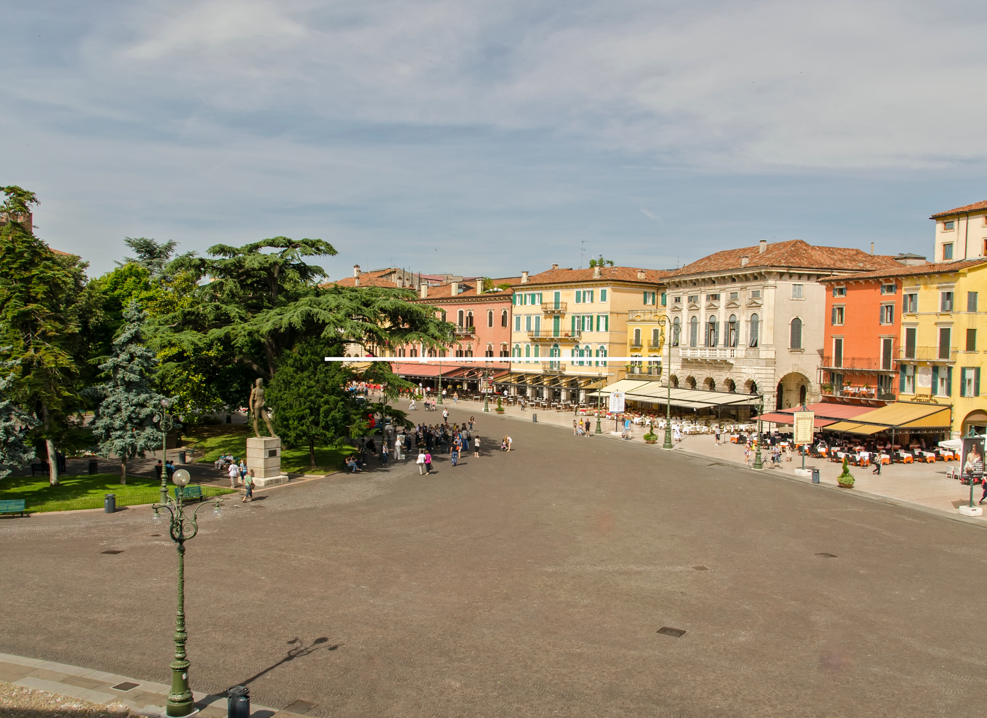 Café culture in Liston Square, Corfu, with Venetian-style arcades.