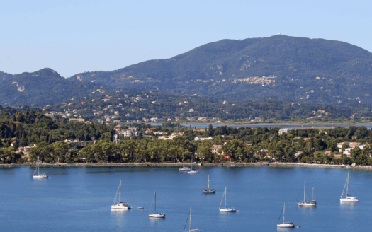 View of Garitsa Bay in Corfu Town with the sea in the background.
