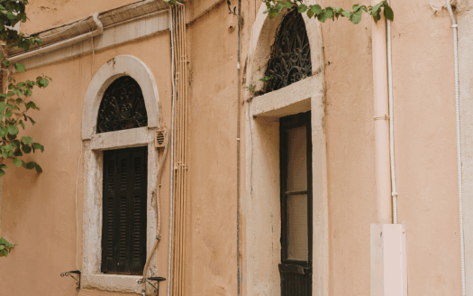 Charming rental villa in Corfu surrounded by lush greenery.