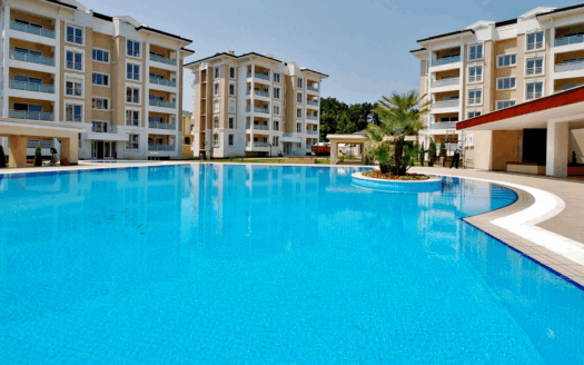 Modern beachfront apartment in Corfu with pool and luxury amenities.