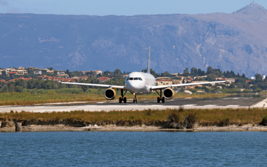 An airplane taking off from the Corfu International Airport runway