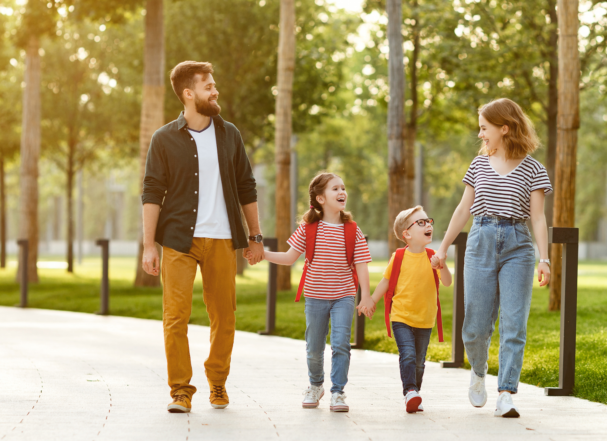Family walking near schools and local shops in Corfu