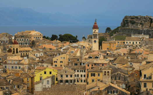 Panoramic view of Corfu Town with its historic buildings and the sea in the background