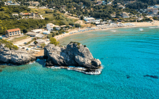 Relaxing at Glyfada Beach, Corfu, with crystal-clear waters and golden sand