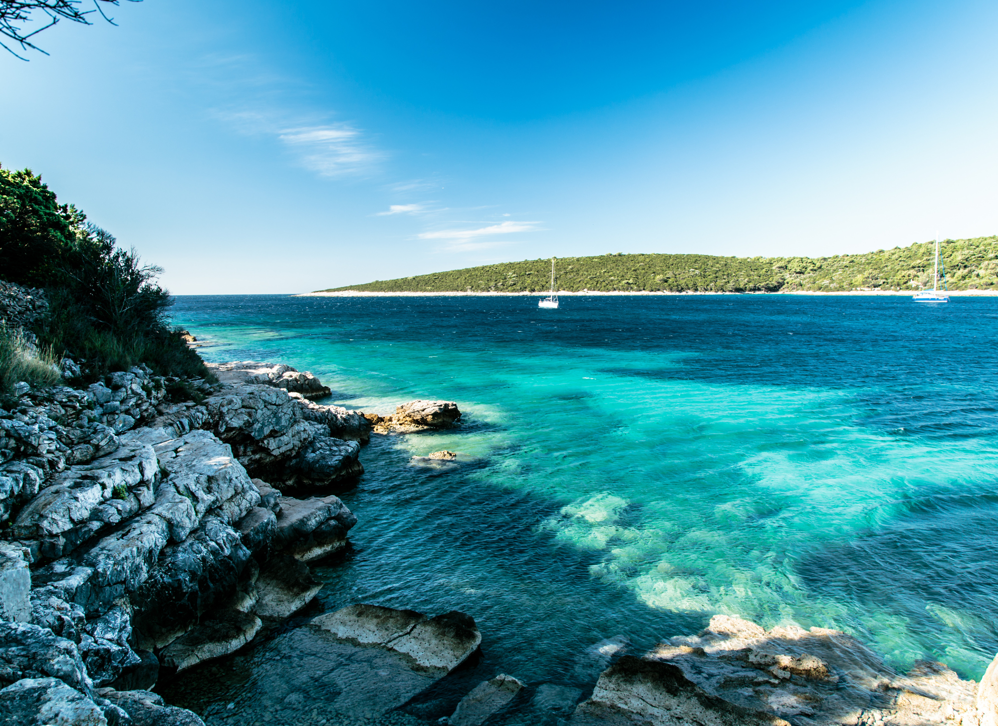 Corfu beach on a sunny summer day with clear blue skies