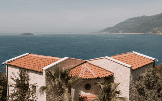 Coastal villa in Corfu with stunning sea view, ideal for real estate investment.