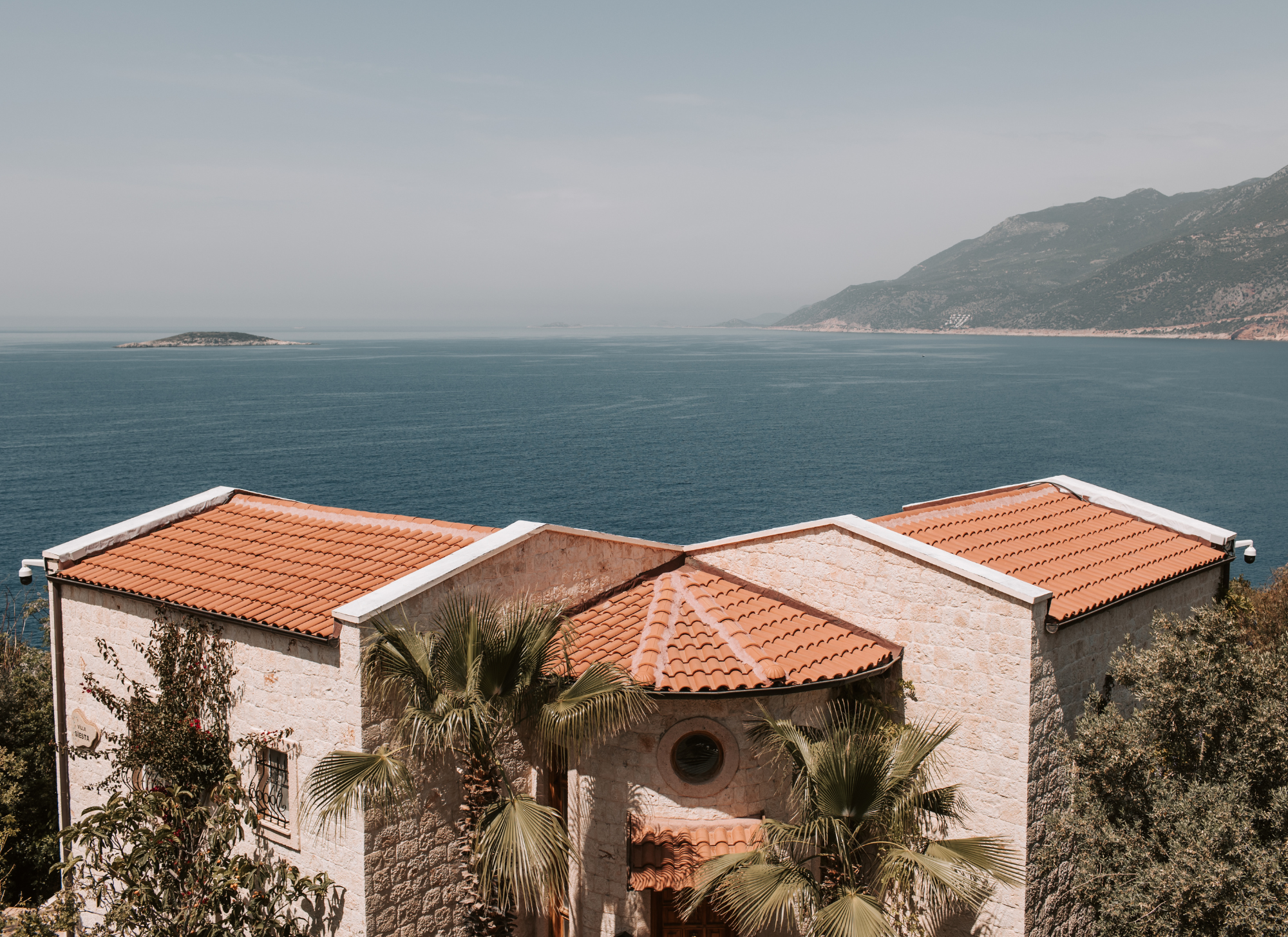 Coastal villa in Corfu with stunning sea view, ideal for real estate investment.